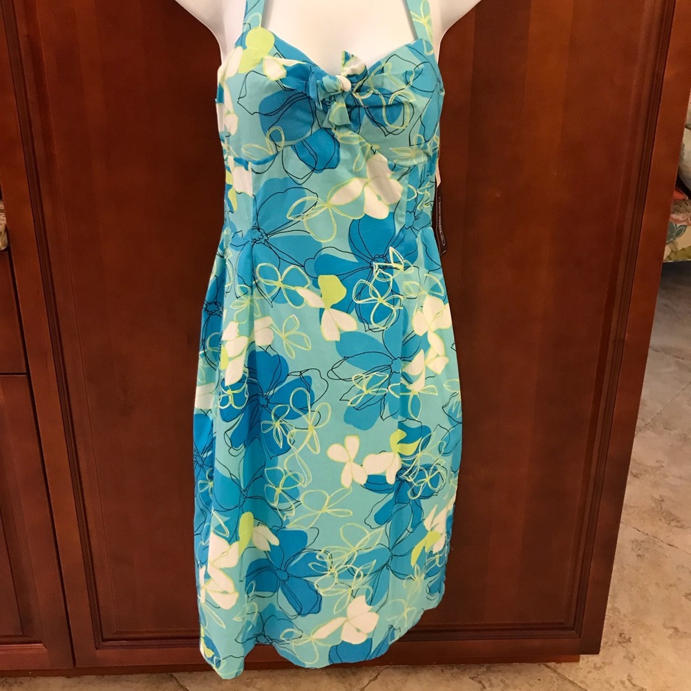 Summer dress in blue, white, and green.